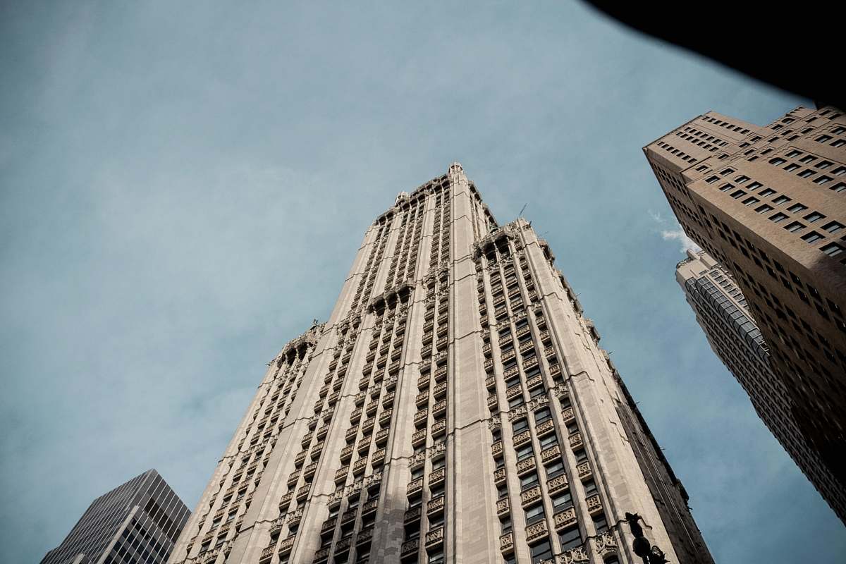 office building low angle photo of tall high rise building architecture